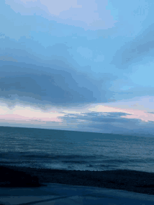 a view of the ocean from a car window