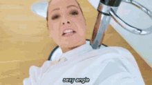 a woman is sitting in a chair with the words sexy angle written on the bottom