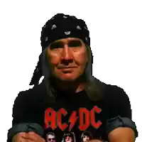 a man wearing a black shirt that says ac/dc on it