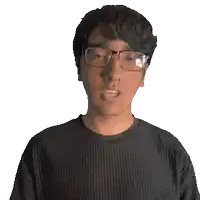 a man wearing glasses and a charlie shirt