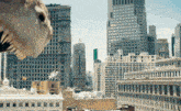 a cityscape with a dinosaur in the foreground and a few buildings in the background