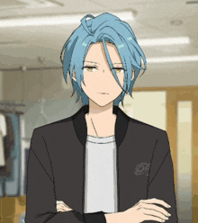 a man with blue hair is wearing a black jacket