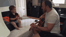 Guitar Lessons Teach You Guitar GIF - Guitar Lessons Teach You Guitar Father Son Bonding GIFs