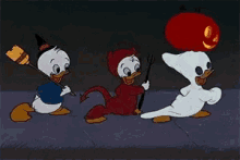 three cartoon characters are dressed up for halloween including a devil and a ghost