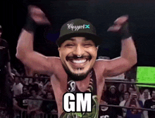 a man wearing a hat that says blizzard on it is smiling in a wrestling ring