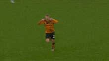 two soccer players on a field with one wearing the number 21