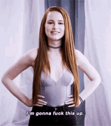 a woman with long red hair is standing with her hands on her hips and says `` i 'm gonna fuck this up . ''