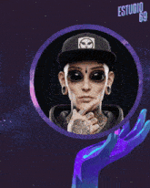 a picture of a person with a hat that says estudio 69 on it