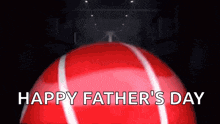 a red tennis ball with the words happy father 's day written on it .