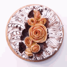 a cake with white frosting and flowers on it