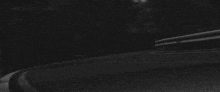 a black and white photo of a car with the license plate number 954j