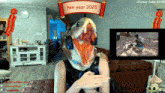 a woman wearing a fish mask on a twitch stream