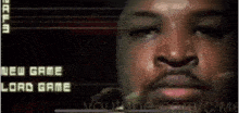 a close up of a man 's face in front of a screen that says new game bad game
