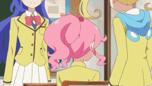 a girl with pink hair is standing next to another girl