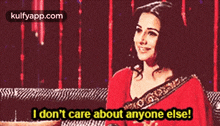 a woman in a red saree is smiling and says i don 't care about anyone else .