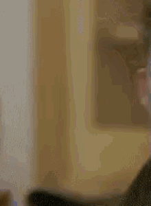 a close up of a man 's face with a very serious look on his face .