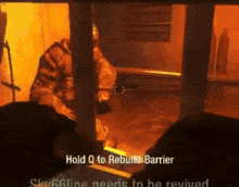 a video game screen shows a man holding a gun and says hold q to rebuilt barrier