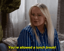 a woman in a blue and white striped shirt says " you 're allowed a lunch break ! "