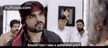 a man with a beard and a bandana on his head is talking to a group of men .