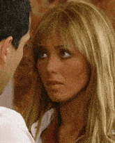 a man and a woman are looking at each other with their eyes closed