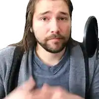 a man with long hair and a beard is wearing a blue shirt