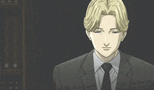 a man in a suit and tie is looking at the camera