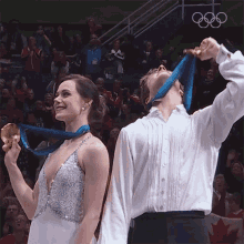 Flexing The Medals Figure Skating GIF - Flexing The Medals Figure Skating Tessa Virtue GIFs