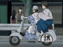 a man and a woman are riding a scooter with chinese characters on it