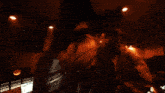 a blurry photo of a man with long hair and a beard