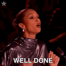 a woman in a silver dress is applauding with the words well done written below her