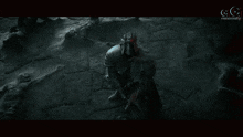 a video game screen shows a knight fighting a monster with the letters gg on the bottom right