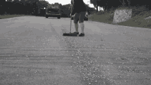 Sweeping Marbles Sweeping GIF - Sweeping Marbles Sweeping Cleaning Up GIFs