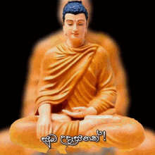 a statue of a buddha sitting on a lotus flower with a foreign language written on it