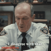 a police officer says " i disagree with that " while sitting at a desk