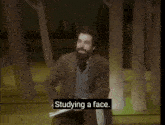 a man with a beard is holding a piece of paper and says " leaves a little space in the way like a window