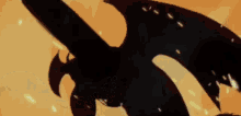a close up of a dragon 's tail with wings flying in the air .