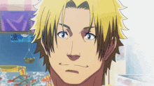 a close up of a man 's face with a yellow hair