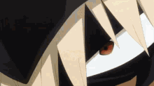 a close up of a person 's face with a red eye