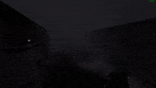 a screenshot of a video game shows a green light in the middle of a dark room
