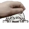a hand is holding a cartoon character 's head with its mouth open .