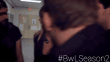 a blurry photo of a group of people with # bwlseason2 written on the bottom