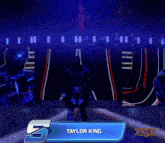 a wrestler stands on a stage with a fnlw logo on the bottom