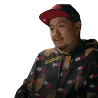 a man wearing a tommy hilfiger hoodie and hat