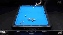 a pool table with a blue cloth says diamond on it