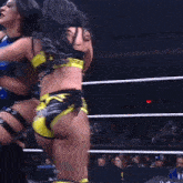 a woman in a wrestling ring is wearing a belt that says power on it