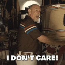 a man says i don 't care in front of a max logo