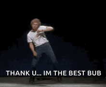 a man is dancing on a stage and saying `` thank you ... im the best bub '' .