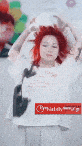 a woman with red hair is wearing a white shirt that says sleep