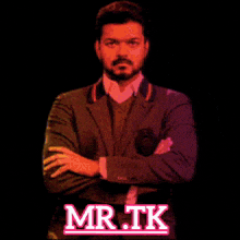 a man in a suit with his arms crossed and the words mr.tk on the bottom