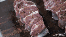 a piece of meat on a cutting board that says made in animatica on the bottom